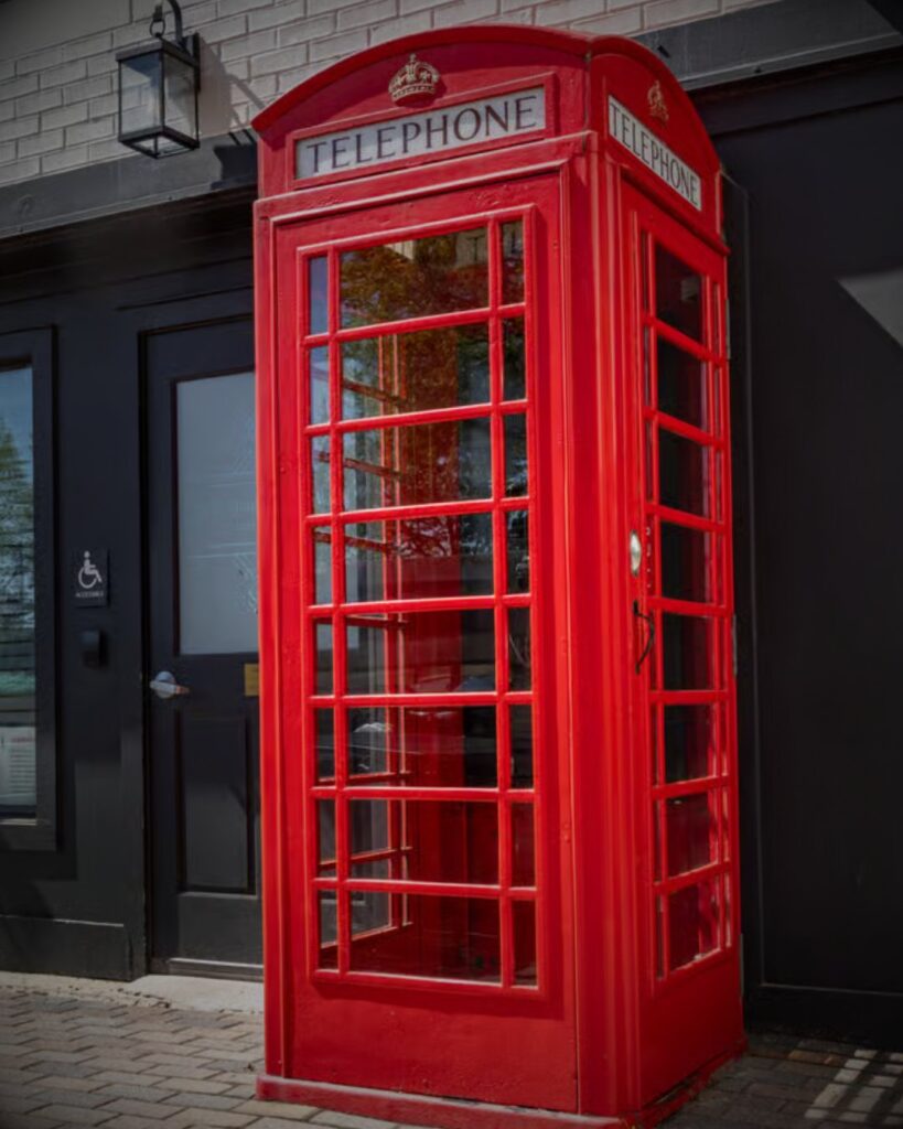 Entrance to the Red Phone Booth Bar in Nashville, marked by a signature red British-style phone booth.