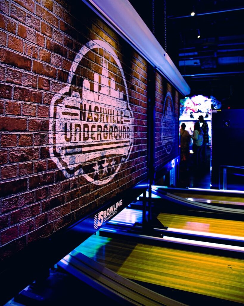 Neon-lit bowling lanes at Nashville Underground, a popular nightlife and entertainment spot in downtown Nashville.
