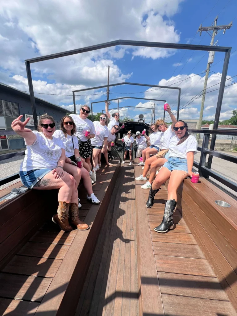 Guests enjoying the open-air BYOB party bus experience on Rowdy Bus Nashville tour through Music City